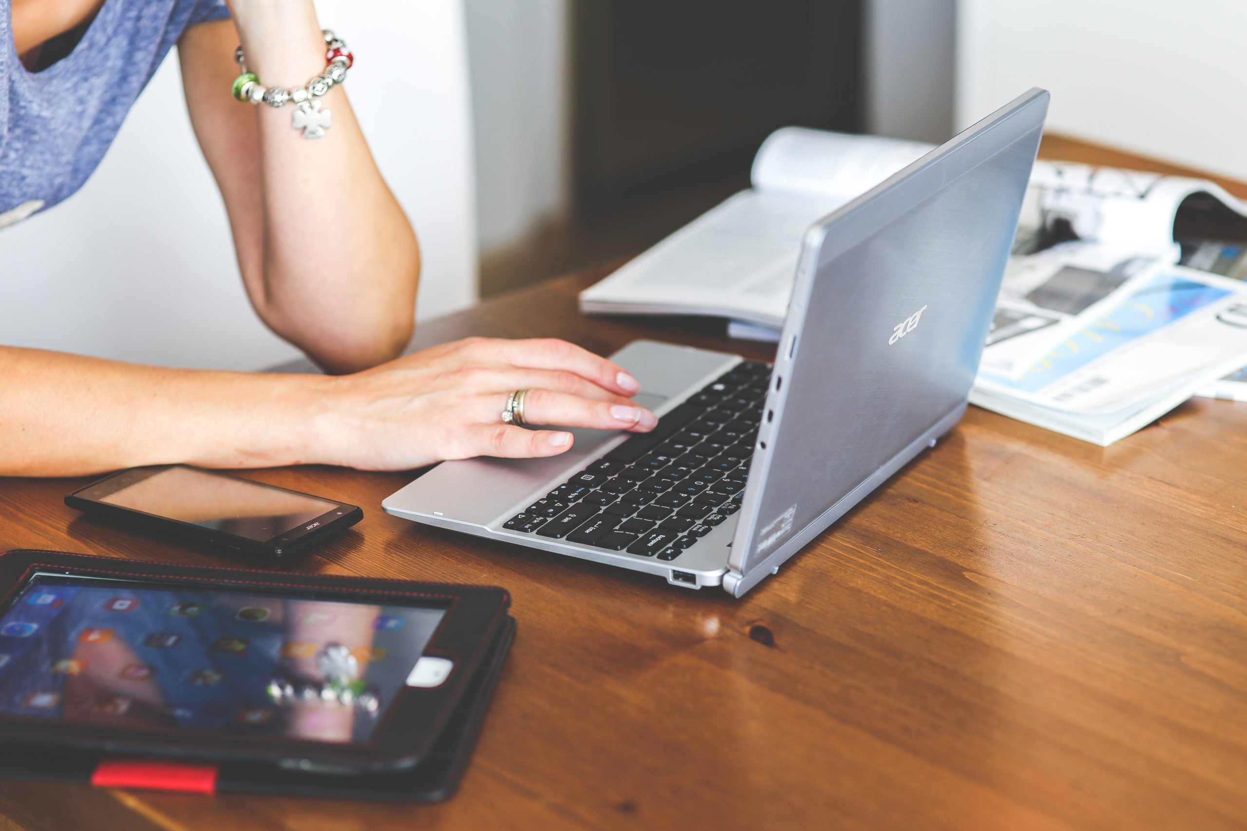 Canva - Close-up of woman typing on keyboard of laptop